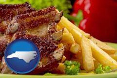 north-carolina map icon and an American restaurant entree (back ribs and french fries)