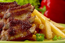 an American restaurant entree (back ribs and french fries)